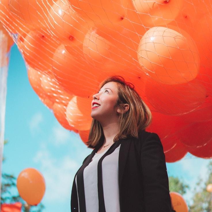 Kaveri Mehta, Lead Design Curator at IslandMossyPath, reviewing corporate floral arrangements